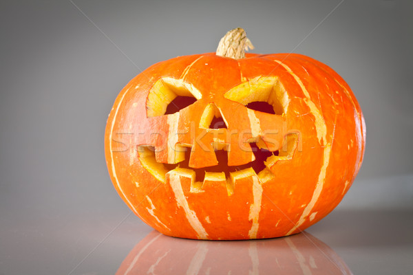 halloween, old jack-o-lantern on grey Stock photo © cookelma