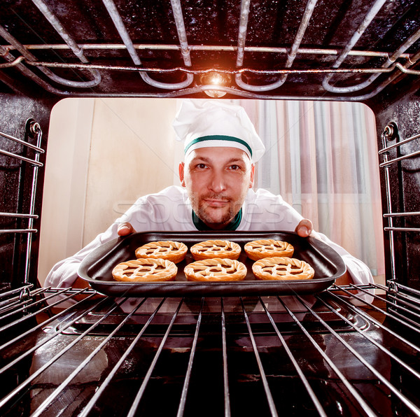 Chef cooking in the oven. Stock photo © cookelma