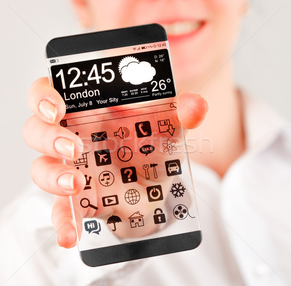 Smartphone przezroczysty ekranu ludzi ręce Widok Zdjęcia stock © cookelma