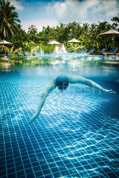Man floats underwater in pool Stock photo © cookelma