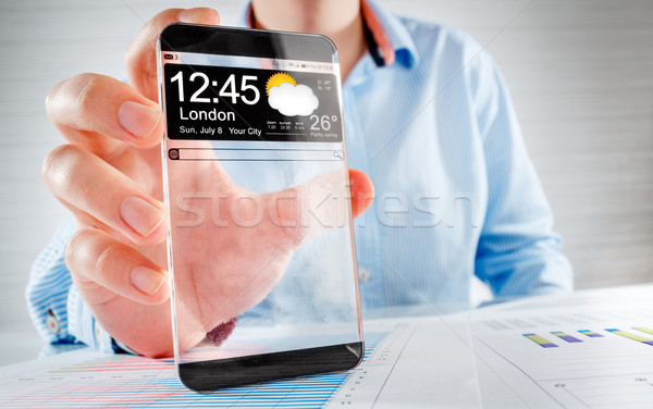 Smartphone trasparente schermo umani mani futuristico Foto d'archivio © cookelma