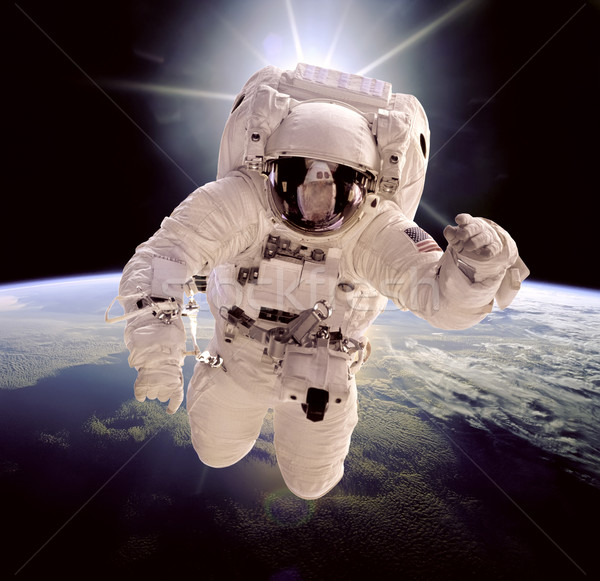 Foto stock: Astronauta · espacio · exterior · fondo · planeta · tierra · elementos · imagen