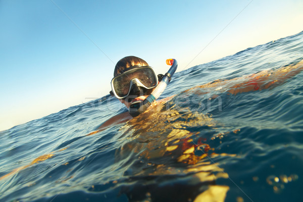 boy floats in the sea Stock photo © cookelma