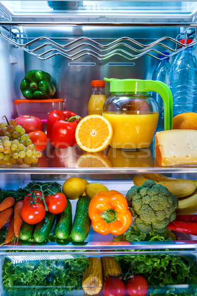 Open refrigerator filled with food Stock photo © cookelma