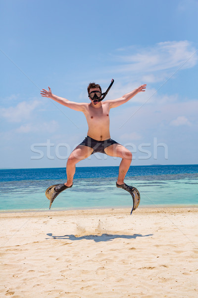 Funny man jumping in flippers and mask. Stock photo © cookelma