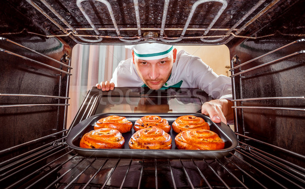 Chef cooking in the oven. Stock photo © cookelma