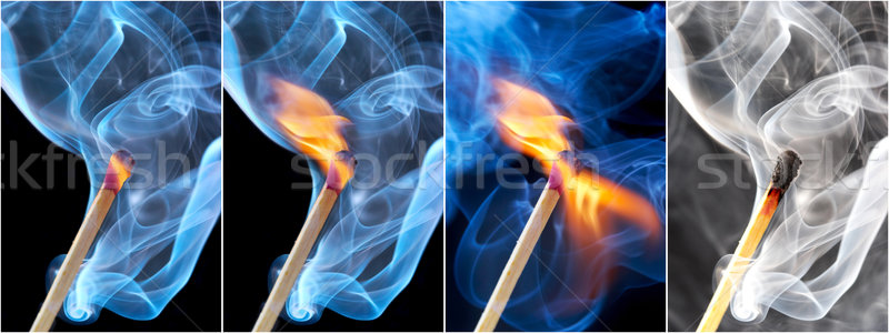 Photo of a burning match in a smoke on a black background Stock photo © cookelma