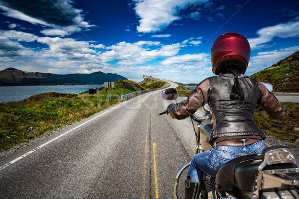 Biker girl rides a mountain road in Norway Atlantic Ocean Road.  Stock photo © cookelma