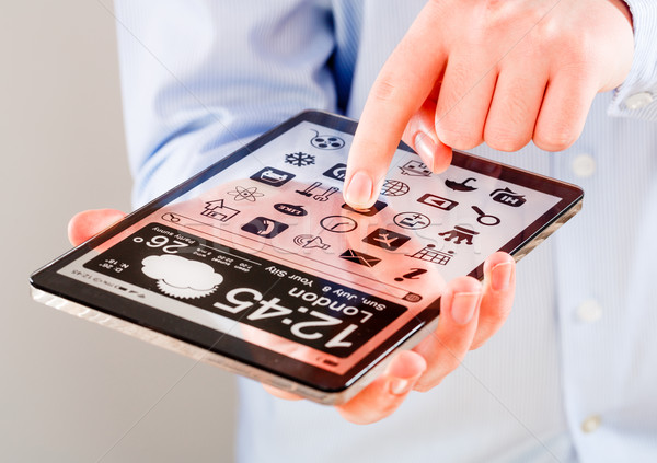 Tablet trasparente schermo umani mani display Foto d'archivio © cookelma