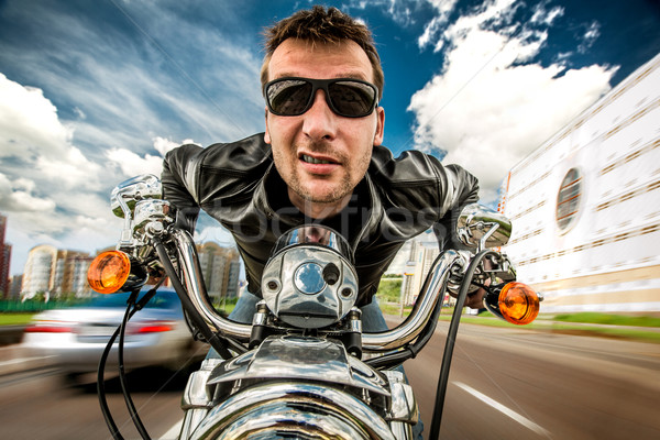 Funny Biker racing on the road Stock photo © cookelma