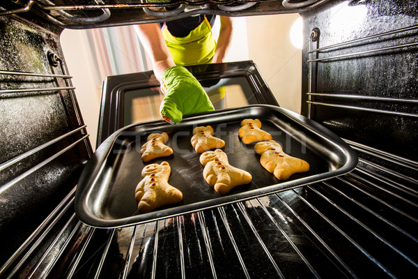 Baking Gingerbread man in the oven Stock photo © cookelma