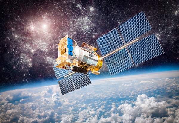 Space satellite over the planet earth Stock photo © cookelma