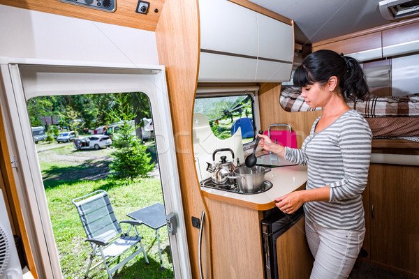 Woman cooking in camper, motorhome interior Stock photo © cookelma