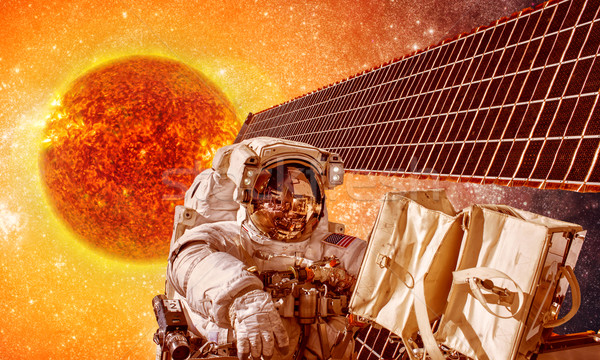 Spacecraft and astronauts in space on background sun star Stock photo © cookelma