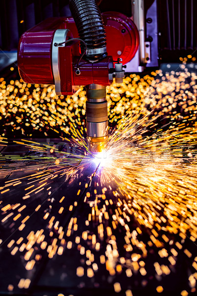 CNC Laser plasma cutting of metal, modern industrial technology. Stock photo © cookelma