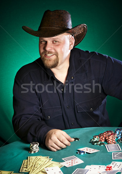 Uomo barba poker mano tavola successo Foto d'archivio © cookelma