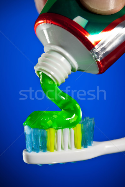 toothpaste being squeezed onto a toothbrush Stock photo © cookelma
