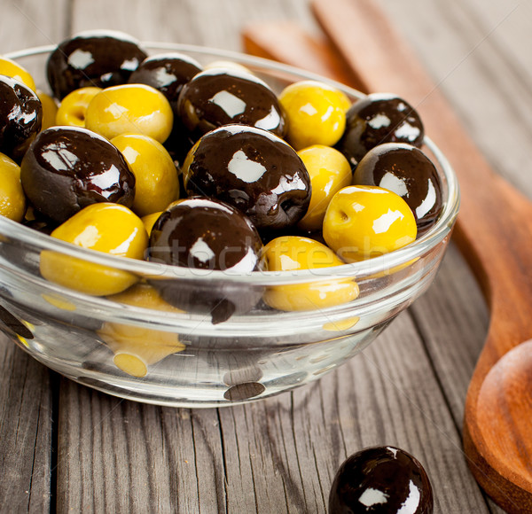 Olives on a wooden table Stock photo © cookelma