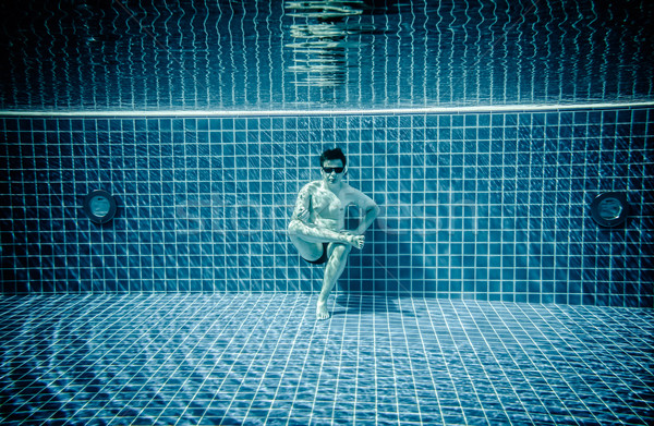 Persons lies under water in a swimming pool Stock photo © cookelma