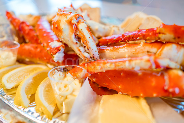 Red king crab legs with fresh lemon slices Stock photo © cookelma