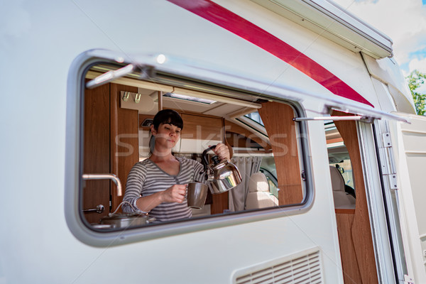 Woman cooking in camper, motorhome interior Stock photo © cookelma