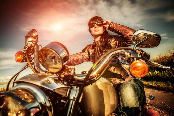 Motoros lány motorkerékpár bőrdzseki néz naplemente Stock fotó © cookelma