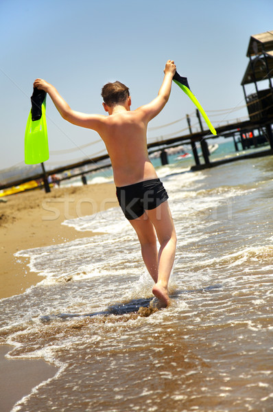 boy goes along seacoast Stock photo © cookelma