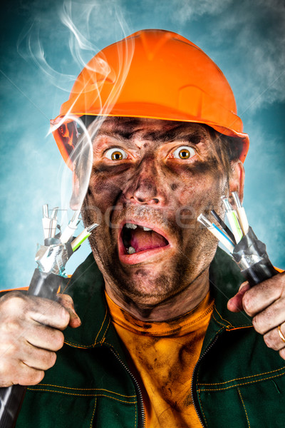 Elektromos rázkódás megrémült villanyszerelő férfi haj Stock fotó © cookelma