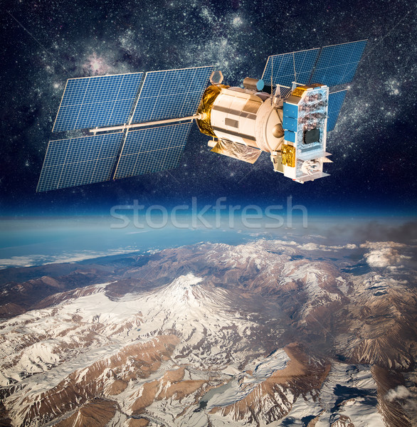 Space satellite over the planet earth Stock photo © cookelma