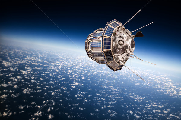 Space satellite over the planet earth Stock photo © cookelma