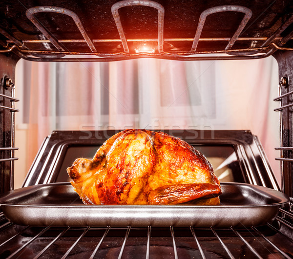 Roast chicken in the oven. Stock photo © cookelma