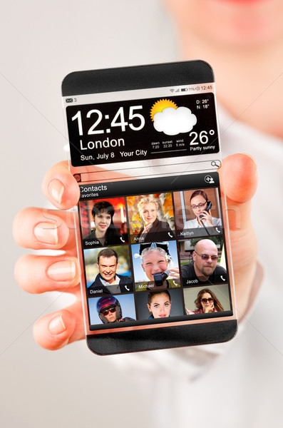 Smartphone trasparente schermo umani mani futuristico Foto d'archivio © cookelma