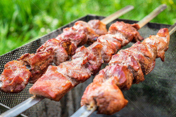 Hot shish kebab on metal skewers Stock photo © cookelma