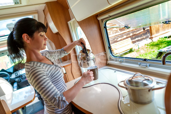 Woman cooking in camper, motorhome interior Stock photo © cookelma