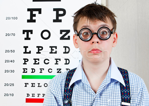 Stock photo: person wearing spectacles in an office at the doctor