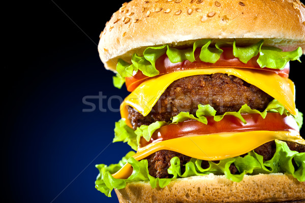Lezzetli iştah açıcı hamburger karanlık mavi bar Stok fotoğraf © cookelma