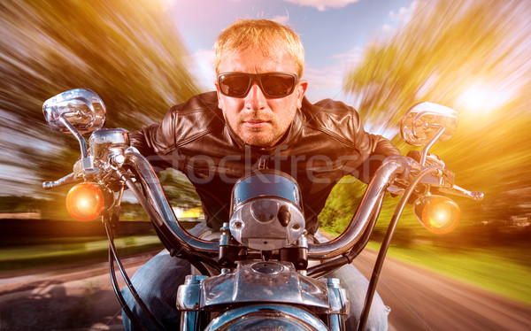 Stock photo: Biker on a motorcycle