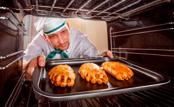 Chef cooking in the oven. Stock photo © cookelma