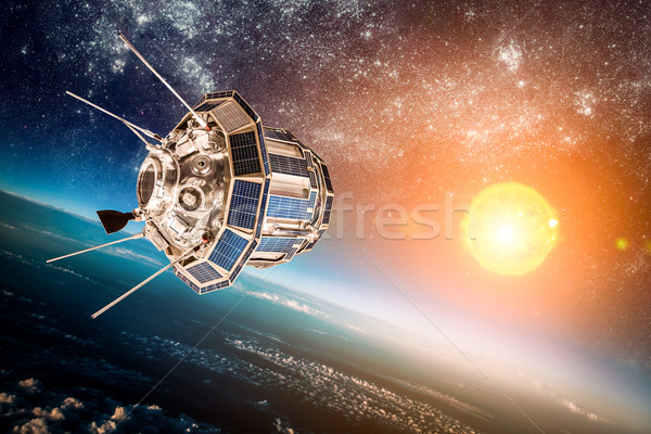 Space satellite over the planet earth Stock photo © cookelma