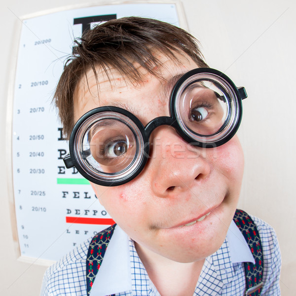 Person wearing spectacles in an office at the doctor Stock photo © cookelma