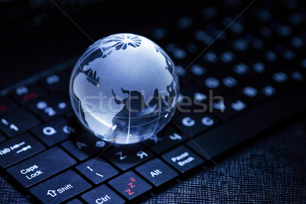 Comunicazione globale internet primo piano vetro mondo tastiera del computer portatile Foto d'archivio © cosma