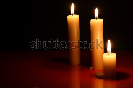 Сток-фото: свечей · темно · три · освещение · отражение · пламени
