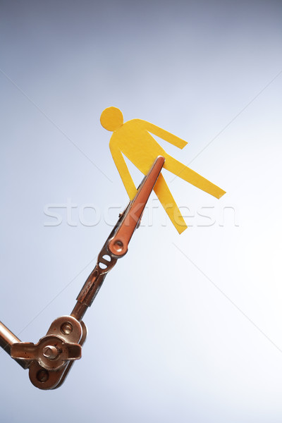 Paper Man In Clamping Device Stock photo © cosma