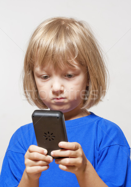 Chłopca gra komputerowa gry odizolowany świetle szary Zdjęcia stock © courtyardpix