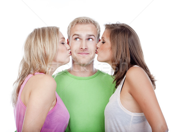 man being kissed by two girls Stock photo © courtyardpix