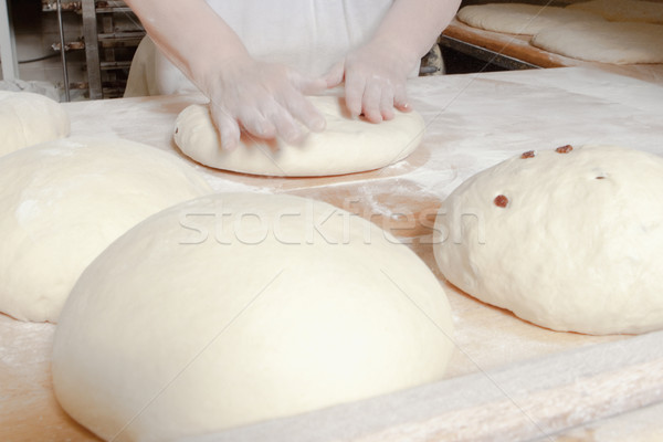 Baker Working with Dough. Stock photo © courtyardpix