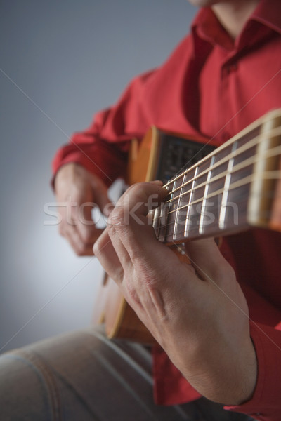Akusztikus gitár közelkép kezek zenész játszik férfi Stock fotó © courtyardpix