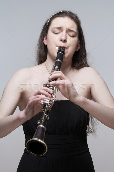 Young Female Musician Playing Clarinet Stock photo © courtyardpix