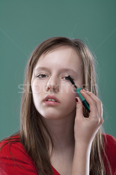 girl putting on makeup Stock photo © courtyardpix
