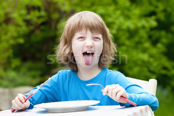 Blond Boy Eating Sticking out his Tongue  Stock photo © courtyardpix